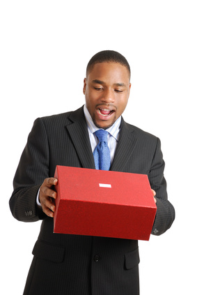 African american business man emptying a christmas gift box