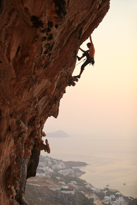 Rock climber at sunset, Kalymnos Island, Greece