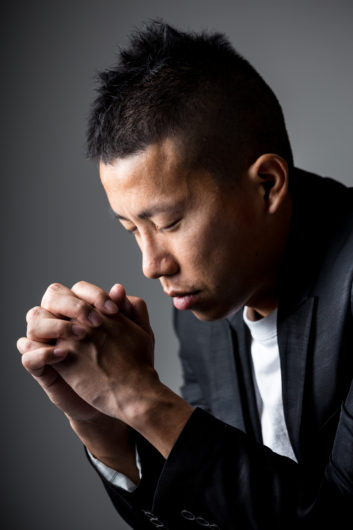 Man pray with cross